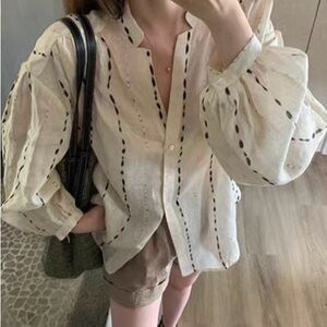 Elegant Cream Blouse with Black Accents